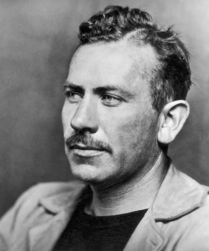 Steinbeck in 1939

McFadden Publications, Inc.; no photographer credited; photo likely the work of Sonya Noskowiak, as Steinbeck is wearing the same clothes from her 1935 studio session that produced the work shown here: https://www.si.edu/object/npg_NPG.2006.74 - Photoplay, November 1939 (page 22).

A black-and-white portrait photograph of Steinbeck with dark, wavy hair, a trimmed mustache, and light stubble. He gazes pensively to the left, wearing a dark crew-neck shirt under a light jacket. The background is a plain, neutral grey.

https://en.wikipedia.org/wiki/John_Steinbeck#/media/File:John_Steinbeck_1939_(cropped).jpg