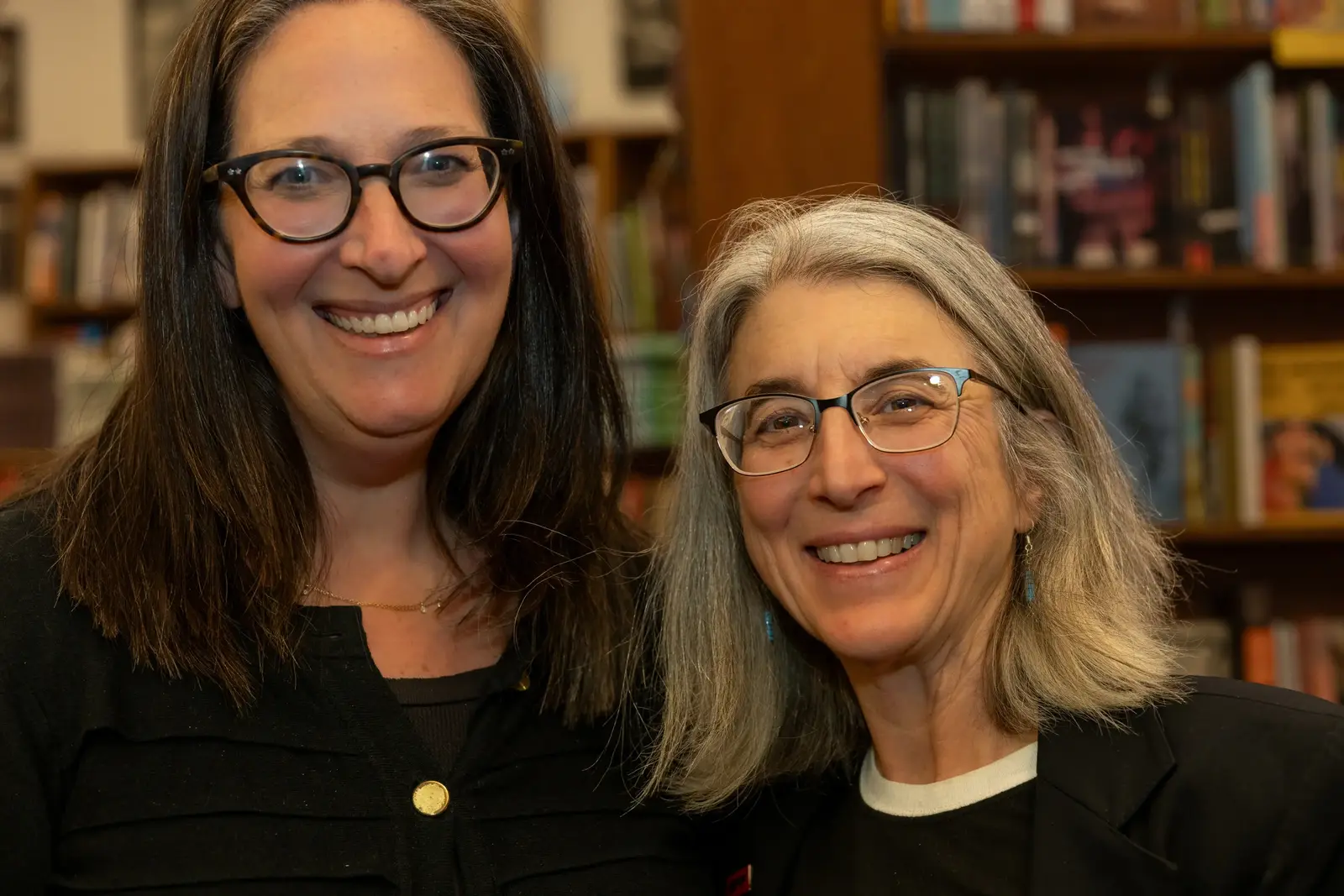 Cindy and Nicky smile at the camera together in City Lights Bookstore.