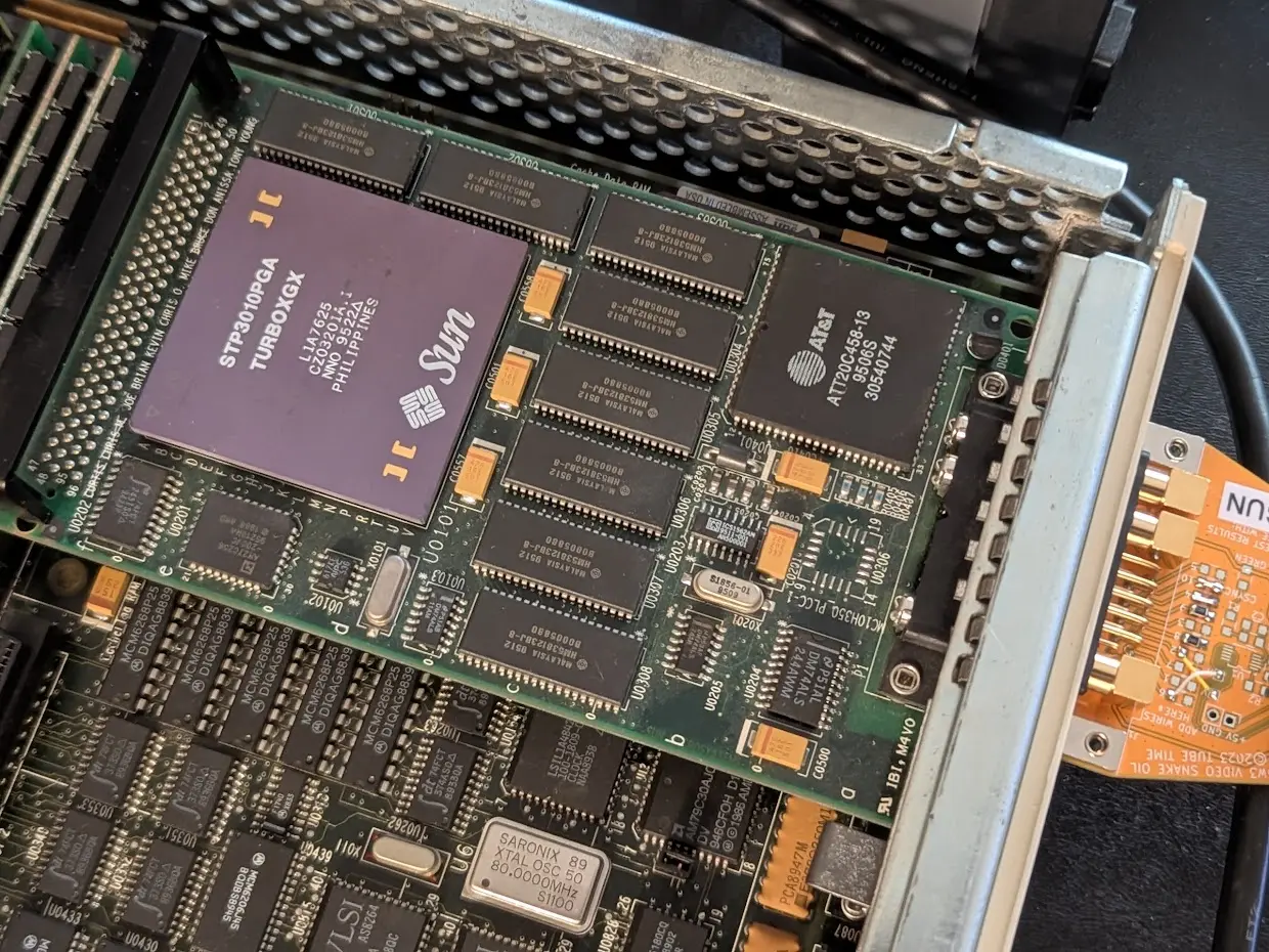small card with a large chip on it marked Sun TURBOXGX