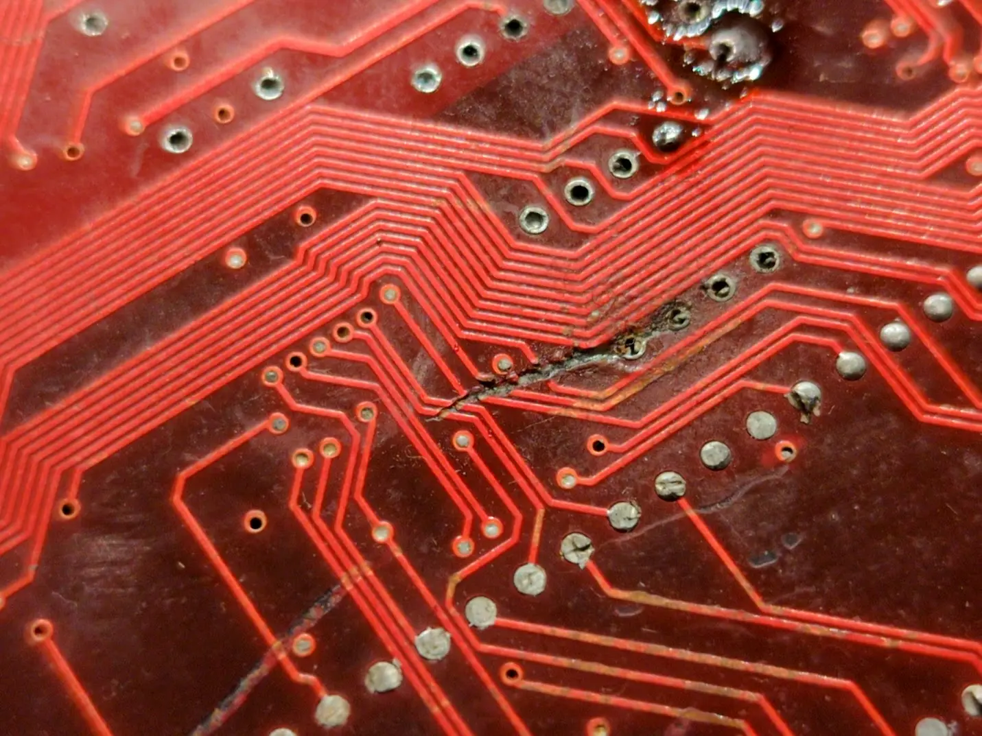 gouged traces, red soldermask. grungy!