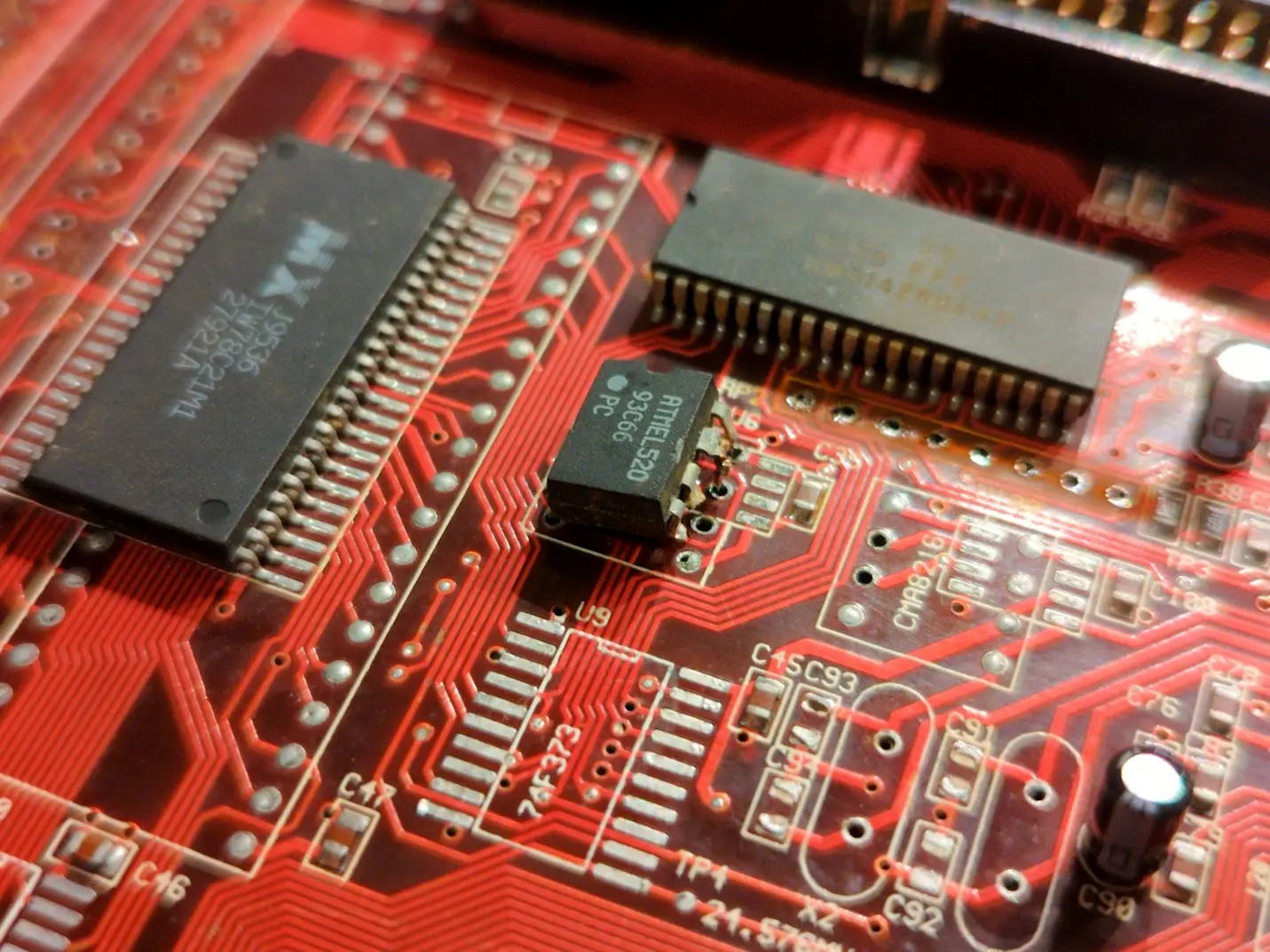 a partially removed DIP 93C66 EEPROM.