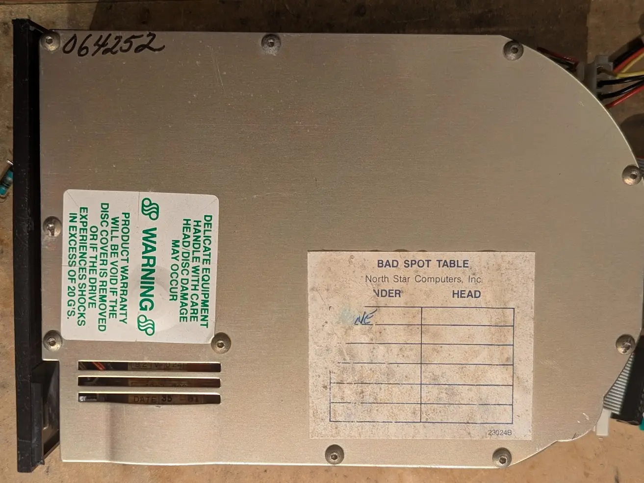 warning stickers and bad block table sticker on top of the hard drive.