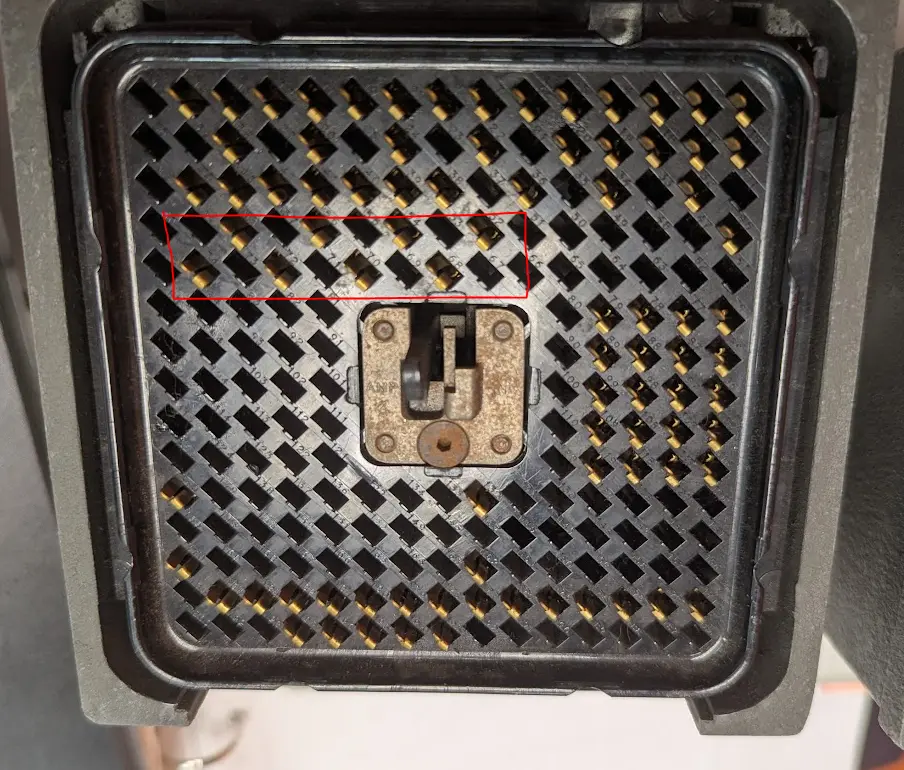 cluster of 8 pins with a red box around them just under the top section. they are empty boxes in the official IBM diagram.
