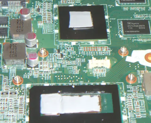 Thermal pad edges not straight because of tearing &amp; refitting what stuck to the peeled film.  After that added pad to chip at back afterwards, and its pad edges are neater.