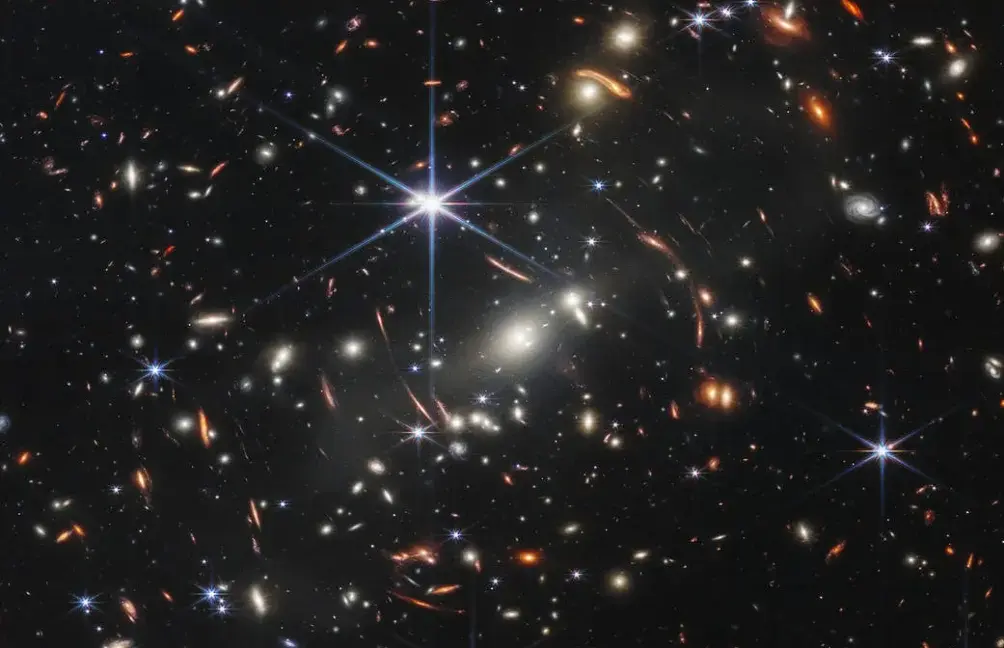 Gravitational lens shows a galaxy just 800 million years post-Big Bang