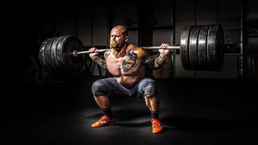 The physics of how Olympic weightlifters exploit barbell's "whip"